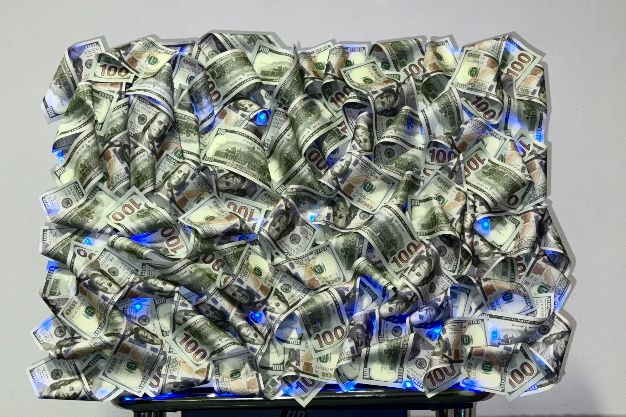 Photo of the same 3D dollar bill painting in daylight
